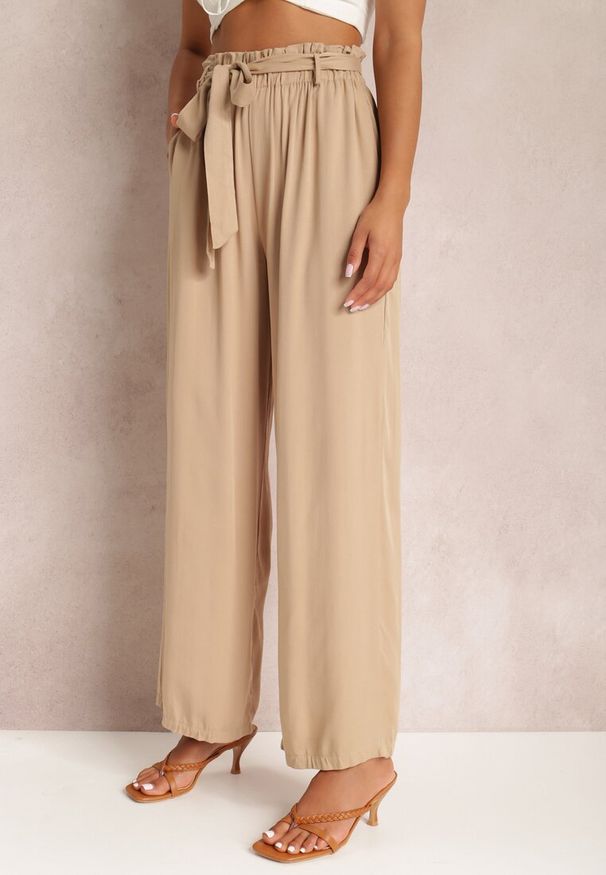 Renee - Beżowe Spodnie Szerokie Phiorephis. Kolor: beżowy. Materiał: tkanina, wiskoza, materiał. Długość: długie. Wzór: gładki, kwiaty