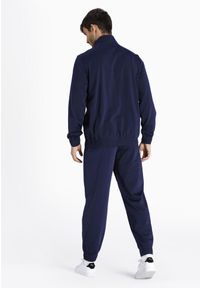 Dres męski Puma Poly Suit. Kolor: zielony, czarny, brązowy, wielokolorowy. Materiał: dresówka