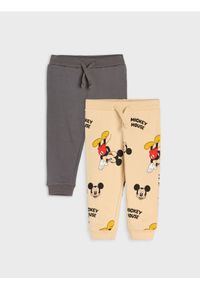Sinsay - Spodnie dresowe 2 pack Mickey Mouse - beżowy. Kolor: beżowy. Materiał: dresówka. Wzór: motyw z bajki