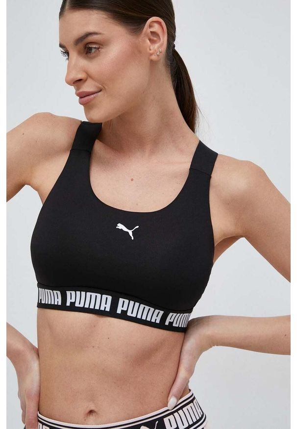 Puma biustonosz sportowy Feel It kolor czarny. Kolor: czarny. Materiał: skóra, materiał. Rodzaj stanika: wyciągane miseczki. Sport: fitness, taniec