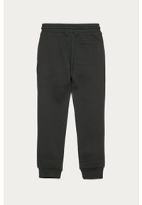 Calvin Klein Jeans - Spodnie dziecięce 128-176 cm. Okazja: na co dzień. Kolor: czarny. Materiał: bawełna, poliester, dzianina. Wzór: aplikacja. Styl: casual #2