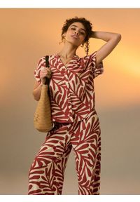 Sinsay - Wiskozowe spodnie wide leg z abstrakcyjnym wzorem - żółty. Kolor: żółty