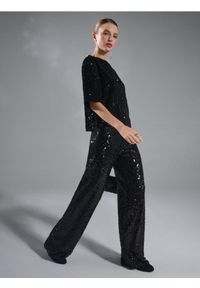 Sinsay - Spodnie wide leg z błyszczącymi cekinami - czarny. Kolor: czarny #1