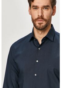 Calvin Klein - Koszula. Typ kołnierza: kołnierzyk klasyczny. Kolor: niebieski. Długość rękawa: długi rękaw. Długość: długie. Styl: klasyczny
