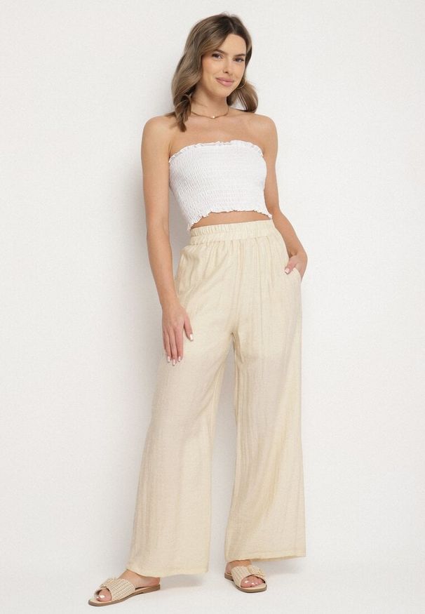 Born2be - Jasnobeżowe Spodnie Palazzo z Lnu i Wiskozy z Wysokim Stanem Linawena. Okazja: na spacer, na co dzień, na spotkanie biznesowe. Stan: podwyższony. Kolor: beżowy. Materiał: wiskoza, len. Sezon: lato. Styl: casual, biznesowy, klasyczny