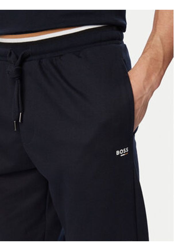 BOSS Spodnie dresowe Iconic 50554830 Granatowy Regular Fit. Kolor: niebieski. Materiał: bawełna