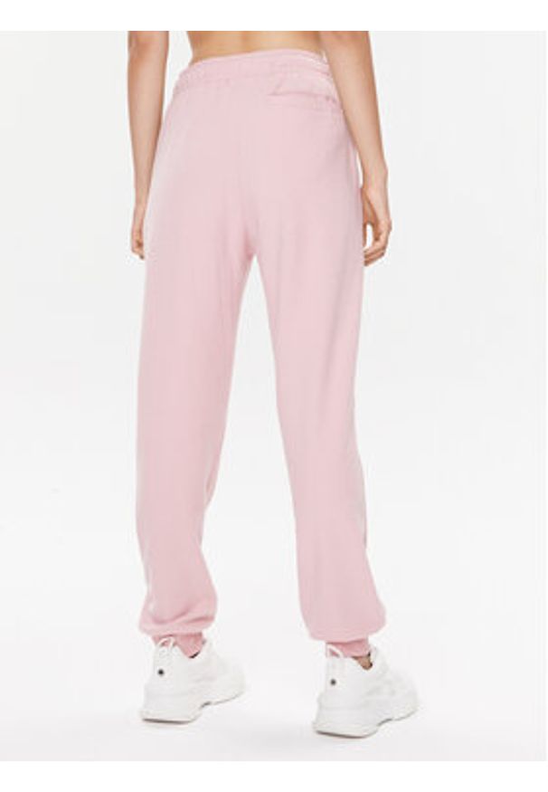 Adidas - adidas Spodnie dresowe IR8371 Różowy Regular Fit. Kolor: różowy. Materiał: syntetyk