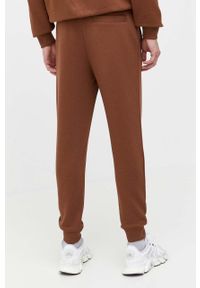 Hugo - HUGO spodnie dresowe bawełniane kolor brązowy melanżowe. Kolor: brązowy. Materiał: bawełna, dresówka, dzianina. Wzór: gładki, melanż #3