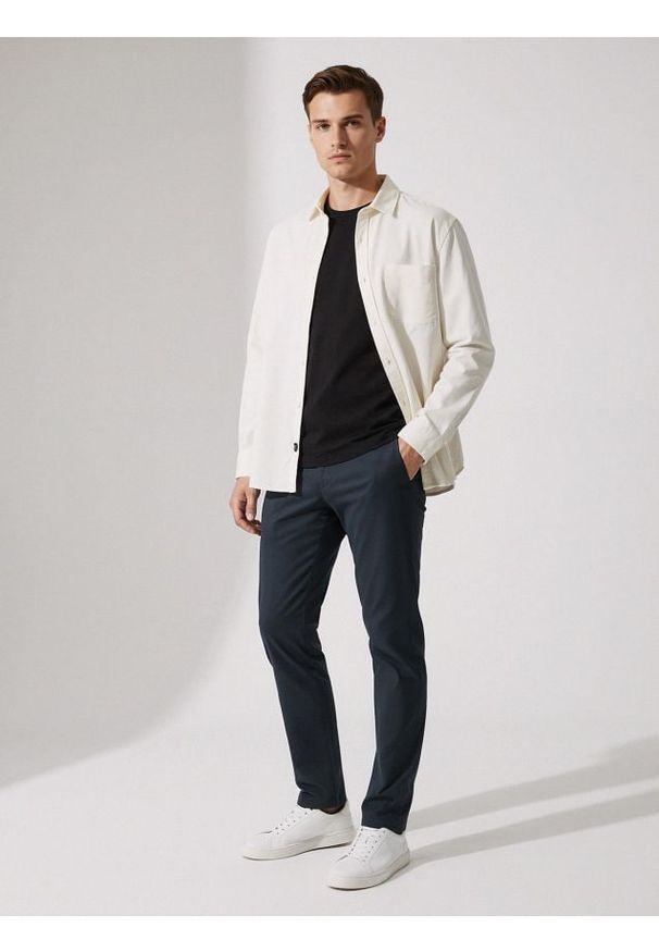 Sinsay - Spodnie chino slim - niebieski. Kolor: niebieski
