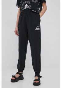 Adidas - adidas spodnie bawełniane damskie kolor czarny z nadrukiem. Stan: podwyższony. Kolor: czarny. Materiał: bawełna. Wzór: nadruk