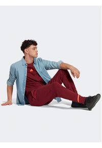 Adidas - adidas Spodnie dresowe Designed for Gameday Tracksuit Bottoms IC8035 Czerwony Slim Fit. Kolor: czerwony. Materiał: dresówka, bawełna