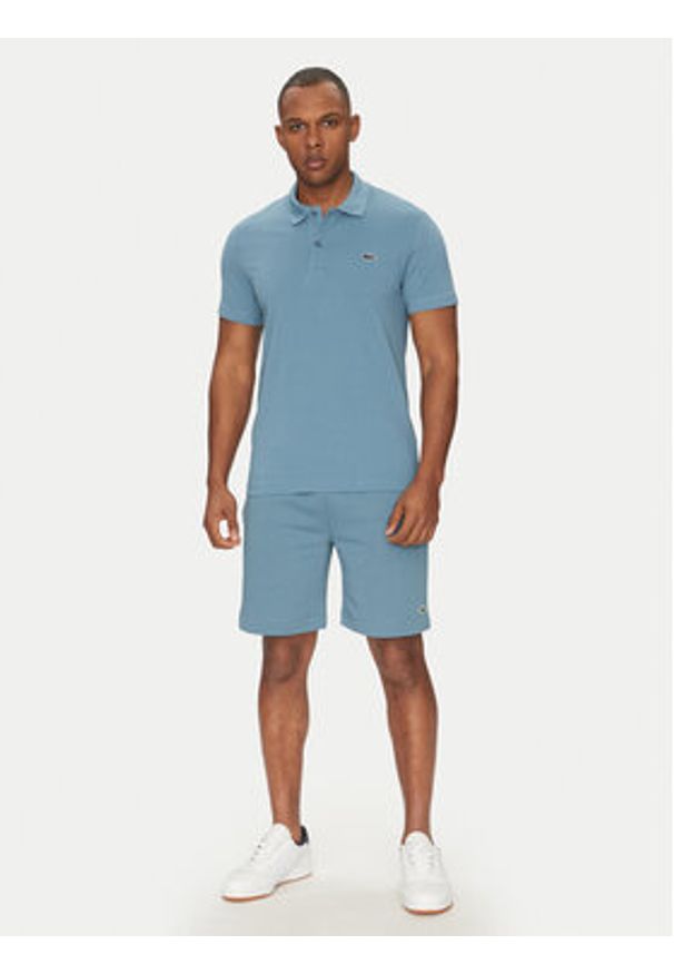 Lacoste Polo DH5522 Niebieski Regular Fit. Typ kołnierza: polo. Kolor: niebieski. Materiał: bawełna, syntetyk