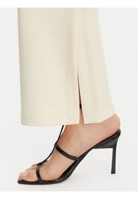 Calvin Klein Spodnie materiałowe LV044B223G Beżowy Flare Fit. Kolor: beżowy. Materiał: syntetyk #3