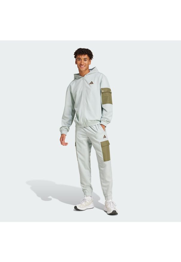 Adidas - Dres Sportswear Woven Cargo. Kolor: szary. Materiał: dresówka