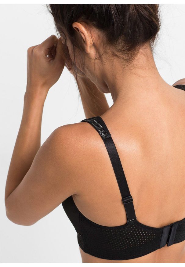 bonprix - Biustonosz sportowy, silny stopień podtrzymywania biustu. Kolor: czarny. Rodzaj stanika: wyściełane miseczki, różne sposoby noszenia