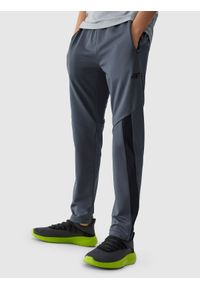 4F JUNIOR - Spodnie sportowe szybkoschnące chłopięce - szare. Kolor: szary. Materiał: syntetyk, elastan, materiał, włókno, dzianina. Wzór: ze splotem, jednolity. Sport: fitness