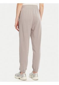 Under Armour Spodnie dresowe Ua Rival 1382735 Beżowy Loose Fit. Kolor: beżowy. Materiał: bawełna