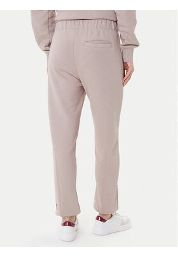 On Spodnie dresowe Club Pants 1WE1005 Beżowy Relaxed Fit. Kolor: beżowy. Materiał: bawełna
