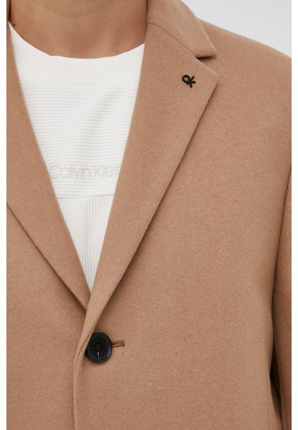 Calvin Klein Płaszcz wełniany kolor beżowy przejściowy. Okazja: na co dzień. Kolor: beżowy. Materiał: wełna. Wzór: gładki. Styl: casual