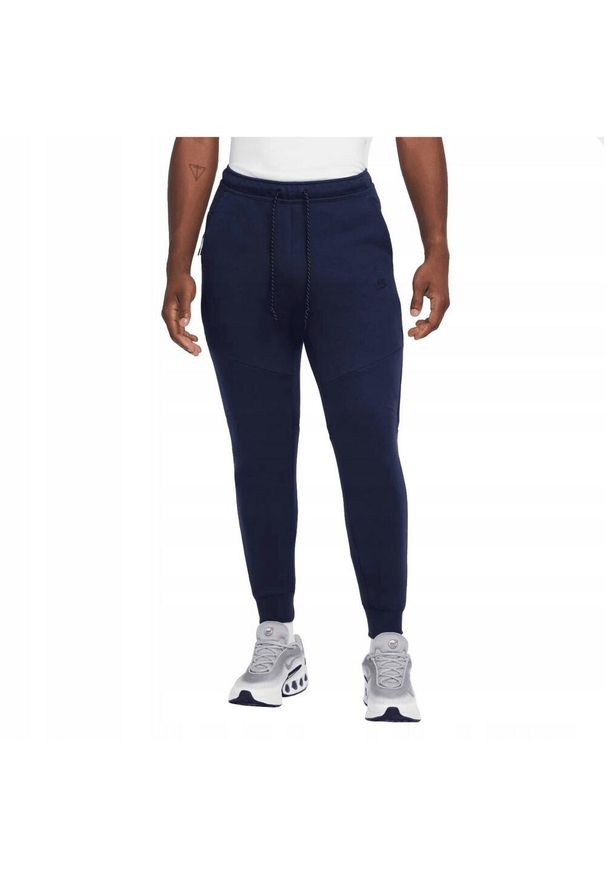 Nike - Męskie Spodnie Do Biegania Tech Fleece. Kolor: niebieski. Materiał: dresówka
