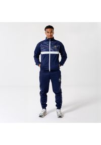 Dres treningowy FFF Francja męski. Kolor: niebieski. Materiał: dresówka. Sport: piłka nożna