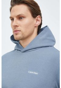 Calvin Klein bluza męska kolor niebieski z kapturem gładka. Typ kołnierza: kaptur. Kolor: niebieski. Materiał: dzianina. Wzór: gładki #5