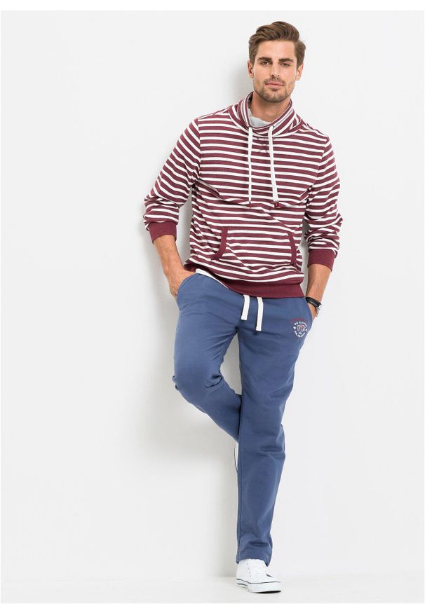 bonprix - Spodnie sportowe z czystej bawełny, ze sportowymi detalami. Kolor: niebieski. Materiał: bawełna. Wzór: nadruk. Styl: sportowy