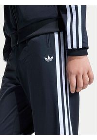 Adidas - adidas Spodnie dresowe Firebird Track KE0910 Czarny Regular Fit. Kolor: czarny. Materiał: syntetyk #7