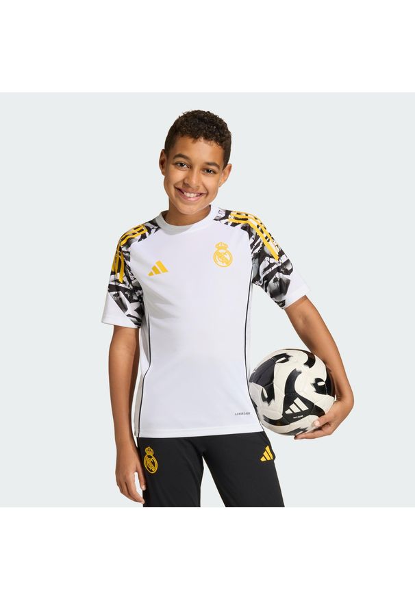 Adidas - Dziecięca koszulka treningowa adidas Real Madrid Avengers 25/26 Tiro25. Kolor: żółty, wielokolorowy, biały. Wzór: motyw z bajki. Sport: piłka nożna