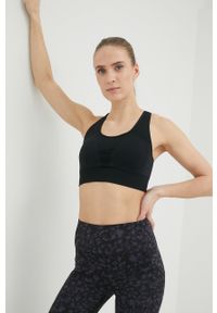 Calvin Klein Performance biustonosz sportowy Seamless kolor czarny gładki. Kolor: czarny. Materiał: skóra, materiał. Rodzaj stanika: wyciągane miseczki. Wzór: gładki. Sport: fitness, taniec #2