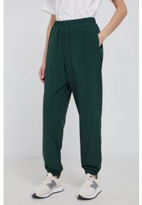 GAP Spodnie dwustronne damskie kolor zielony joggery medium waist. Kolor: zielony. Materiał: materiał