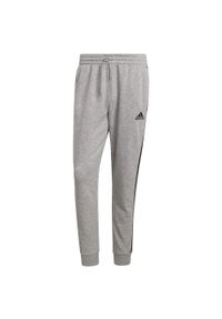 Adidas - Spodnie męskie adidas Essentials Tapered Cuff 3 Stripes. Kolor: wielokolorowy, szary, czarny. Materiał: polar #1