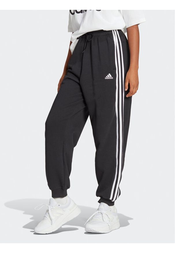 Adidas - adidas Spodnie dresowe Essentials 3-Stripes French Terry Loose-Fit Joggers HA4375 Czarny Loose Fit. Kolor: czarny. Materiał: bawełna