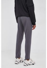 Calvin Klein Jeans Spodnie męskie kolor szary gładkie. Kolor: szary. Materiał: dzianina, włókno, bawełna. Wzór: gładki