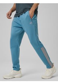 4f - 4F Spodnie treningowe szybkoschnące męskie - granatowe XXL. Kolor: niebieski. Materiał: skóra. Sport: fitness #2