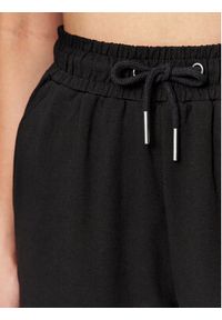Fila Spodnie dresowe FAW0559 Czarny Relaxed Fit. Kolor: czarny. Materiał: dresówka, bawełna #3