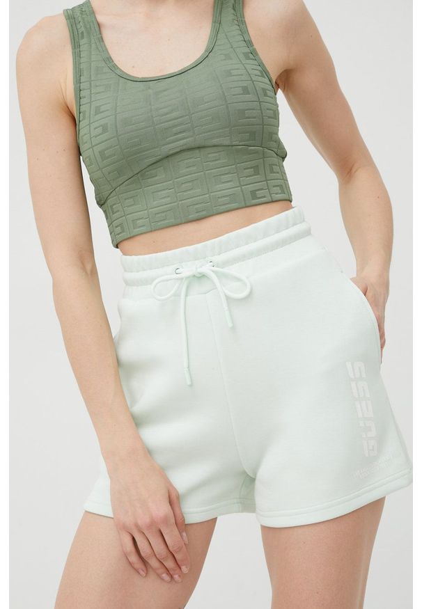 Guess szorty damskie kolor turkusowy z nadrukiem high waist. Stan: podwyższony. Kolor: turkusowy. Wzór: nadruk