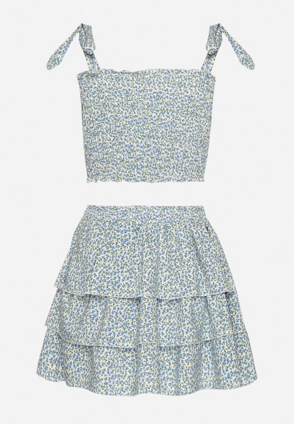 Born2be - Jasnoniebieski Komplet w Kwiaty Elastyczny Top z Wiązaniami i Rozkloszowana Spódniczka Natilana. Kolor: niebieski. Wzór: kwiaty