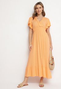 Born2be - Pomarańczowa Wiskozowa Kopertowa Sukienka o Rozkloszowanym Kroju Nellrive. Okazja: na co dzień. Typ kołnierza: dekolt w serek. Kolor: pomarańczowy. Materiał: wiskoza. Długość rękawa: krótki rękaw. Typ sukienki: kopertowe. Styl: casual, elegancki #1