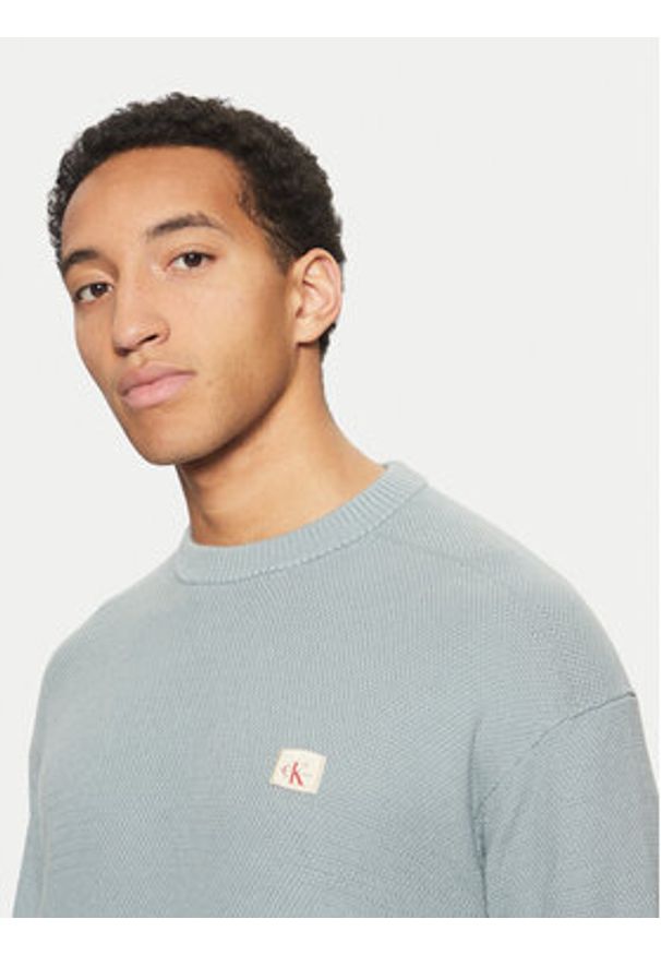 Calvin Klein Jeans Sweter J30J326746 Niebieski Relaxed Fit. Kolor: niebieski. Materiał: bawełna