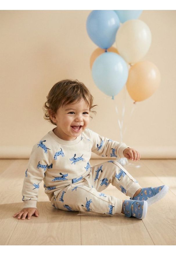 Sinsay - Spodnie jogger ze wzorem - kremowy. Kolor: kremowy