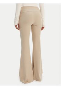 Adidas - adidas Legginsy Essentials KD3850 Beżowy Flared Leg. Kolor: beżowy. Materiał: wiskoza #4