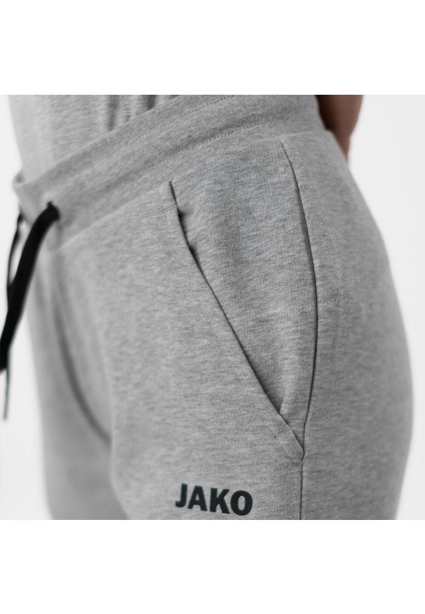 Spodnie dresowe z mankietami dla kobiet Jako Base. Kolor: szary. Materiał: dresówka. Sport: piłka nożna