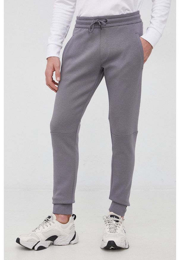 Calvin Klein Jeans Spodnie J30J319652.PPYY męskie kolor szary z nadrukiem. Kolor: szary. Materiał: włókno, dzianina. Wzór: nadruk