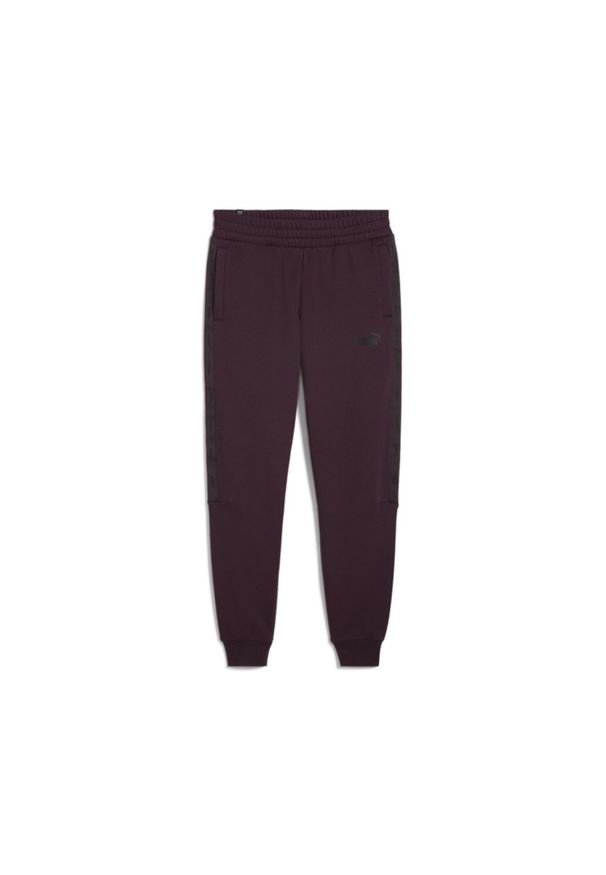 Puma Spodnie Ess+ Tape Fl Cl 84904245. Kolor: fioletowy. Materiał: dresówka