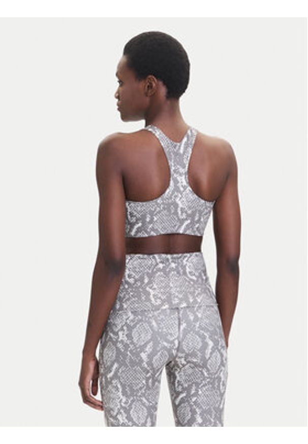 Adidas by Stella McCartney - adidas by Stella McCartney Biustonosz sportowy Power Impact JM6092 Beżowy Slim Fit. Kolor: beżowy. Materiał: syntetyk