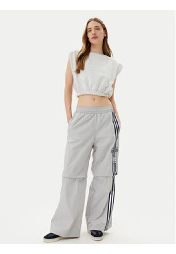 Adidas - adidas Spodnie dresowe Adibreak JJ3122 Szary Regular Fit. Kolor: szary. Materiał: syntetyk