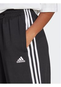 Adidas - adidas Spodnie dresowe Essentials 3-Stripes French Terry Loose-Fit Joggers HA4375 Czarny Loose Fit. Kolor: czarny. Materiał: bawełna #3