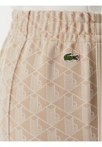 Lacoste Spodnie dresowe XF9313 Beżowy jasny Regular Fit. Kolor: beżowy. Materiał: syntetyk #4
