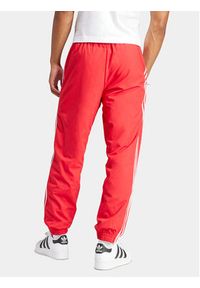 Adidas - adidas Spodnie dresowe Adicolor Woven Firebird IT2498 Czerwony Regular Fit. Kolor: czerwony. Materiał: syntetyk